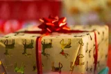 A wrapped gift with a red ribbon