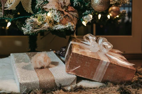 Wrapped gifts arranged with pine and ribbon