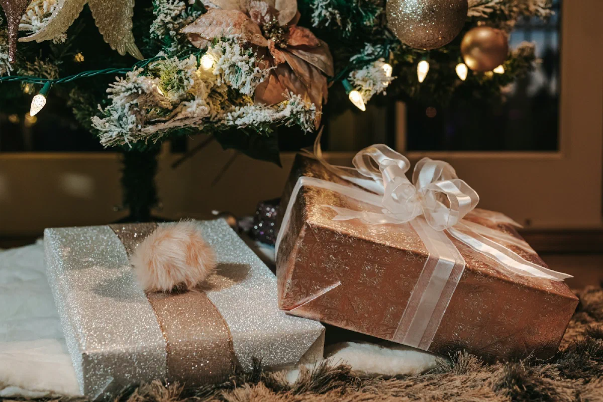 Wrapped gifts arranged with pine and ribbon