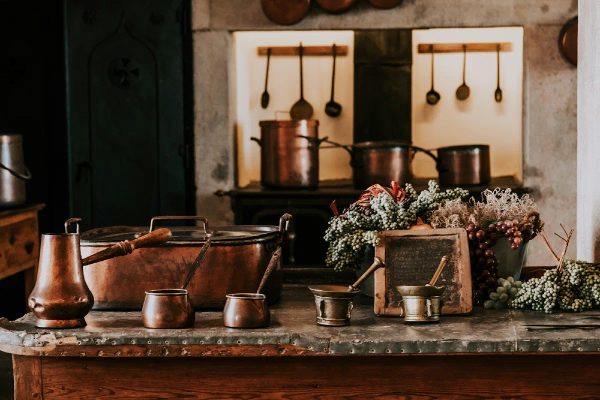 A shelf of brass vessels