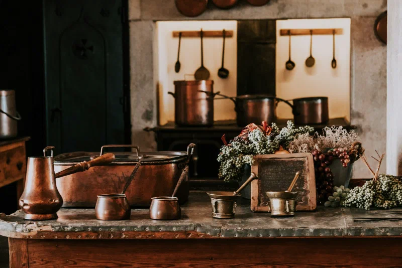 A shelf of brass vessels